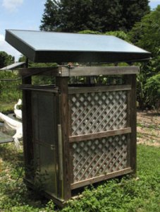 Passive collector mounted on top of outdoors shower.