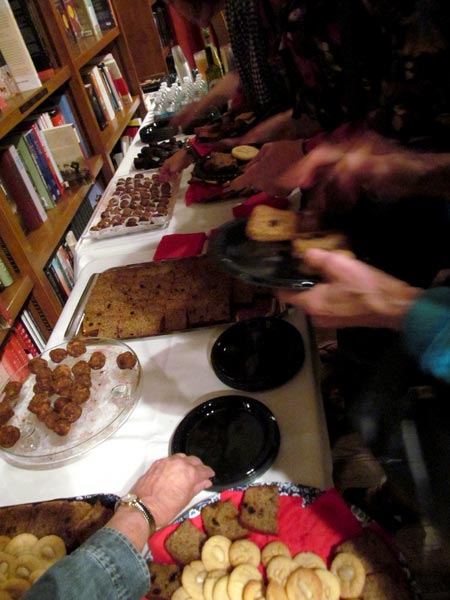 The dessert table loaded with platters of seed cake, vegan chocolate cake, orange blossom cookies and multifaith sweetness and light sugarplums.